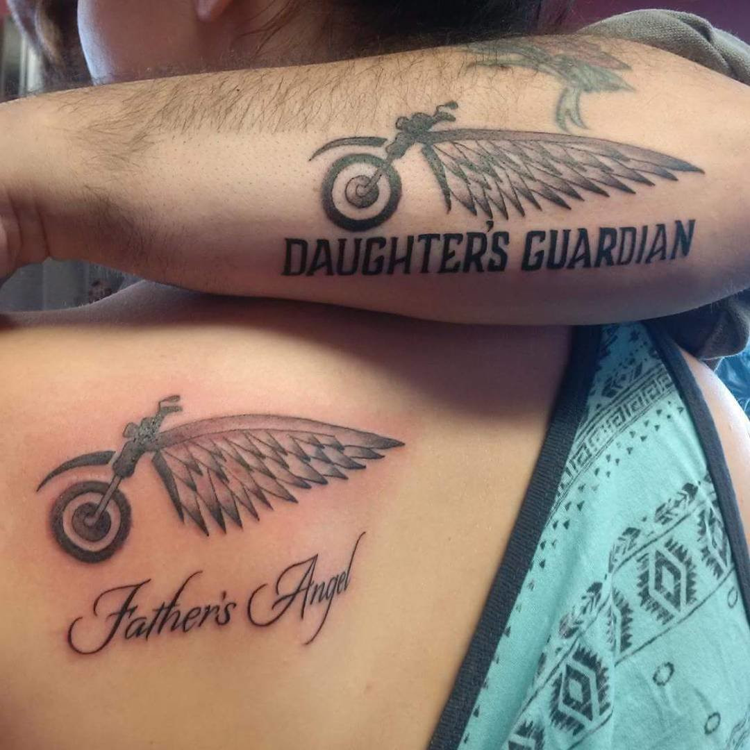 Father and daughter displaying forearm tattoos featuring Harley-Davidson logos with phrases &quot;Father's Angel&quot; and &quot;Daughter's Guardian,&quot; perfect for biker families.