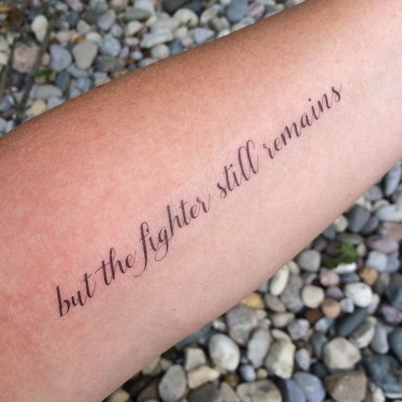 Quote tattoo &quot;But The Fighter Still Remains&quot; for strong survivors