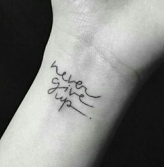 Inspirational quote tattoo &quot;Never Give Up&quot; on wrist