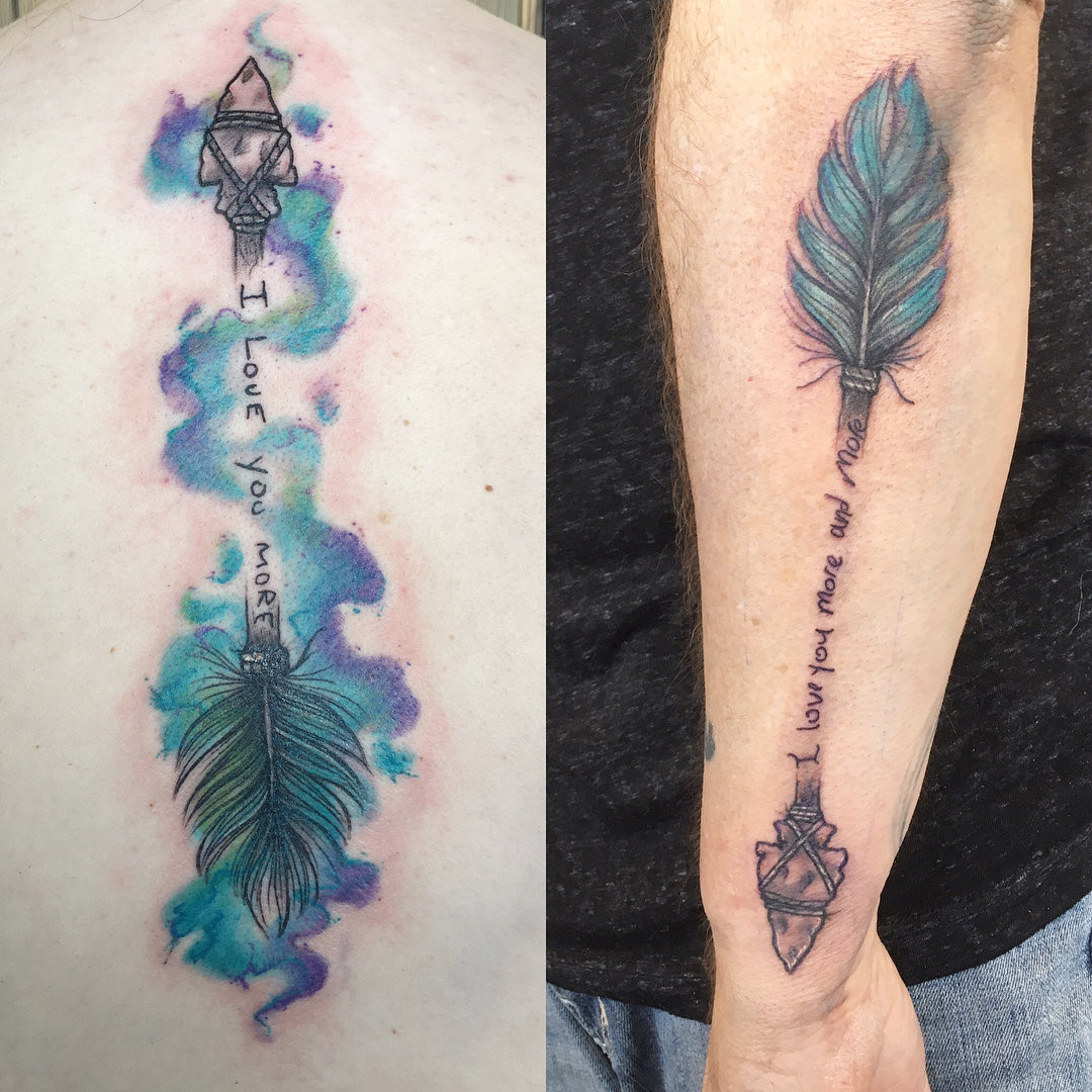 Father and daughter displaying forearm tattoos of arrow designs in blue and purple, symbolizing direction and moving forward together, with subtle feminine and masculine variations.