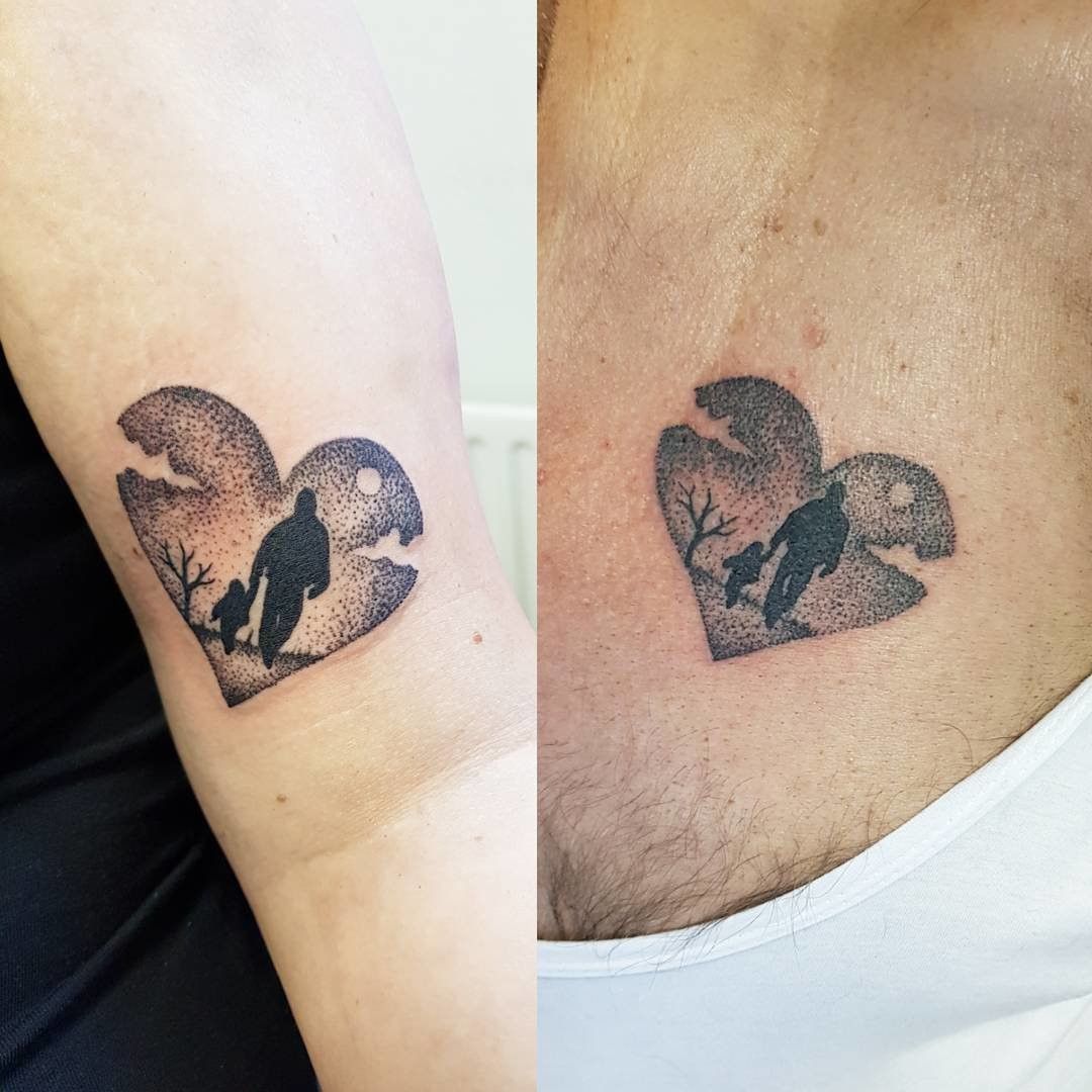 Father and daughter displaying forearm tattoos of dotted heart designs, adding a delicate and intricate touch to the classic heart symbol.