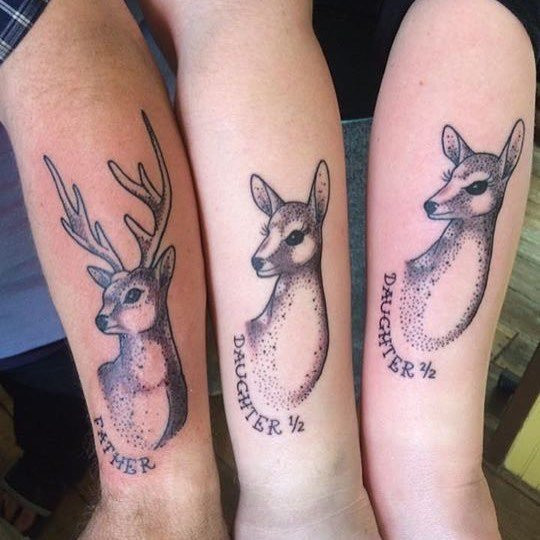 Father and daughter showcasing forearm tattoos of deer designs, symbolizing gentleness, love for nature, and shared outdoor interests like hunting.