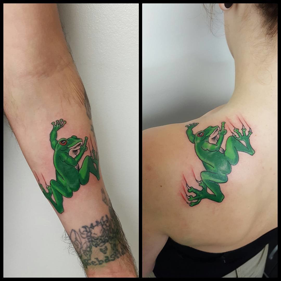 Father and daughter showcasing forearm tattoos of tree frog designs, vibrant and playful, symbolizing transformation and a lively connection.