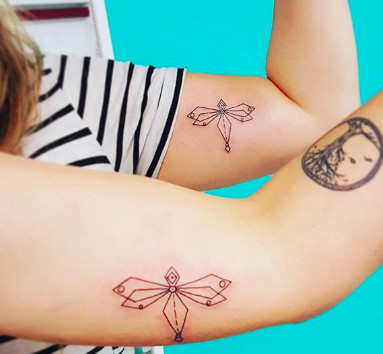 Geometric dragonfly tattoos, representing freedom, change, and supportive friendship