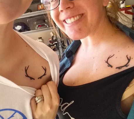 Deer antler tattoos, representing nature, strength, and a rustic, outdoorsy friendship