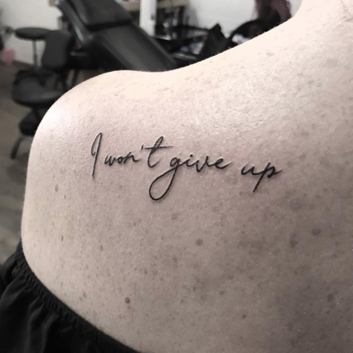 Quote tattoo &quot;I Won't Give Up&quot; in elegant script