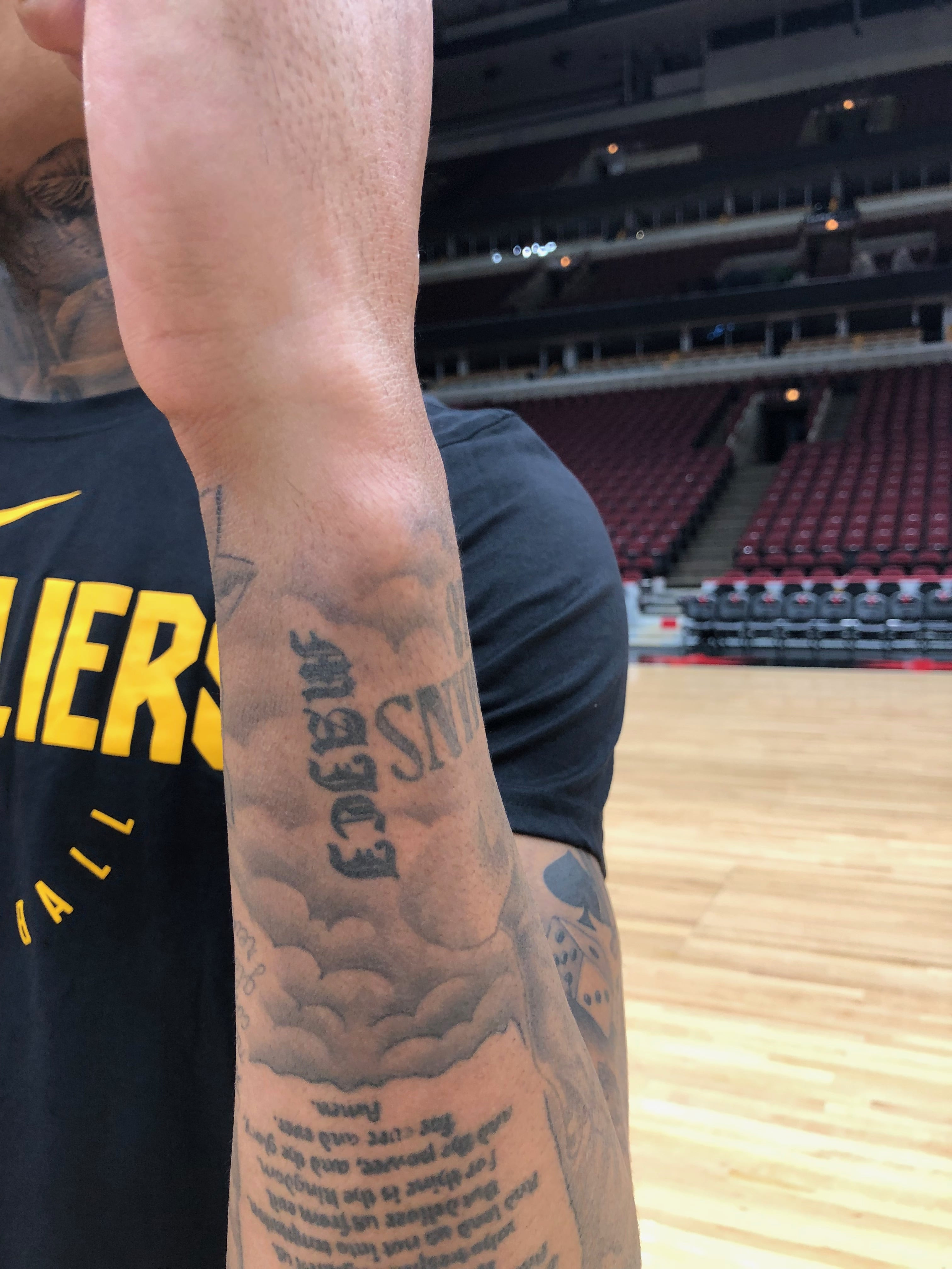 A close-up shot of Jordan Clarkson getting a tattoo, highlighting the process and artistry