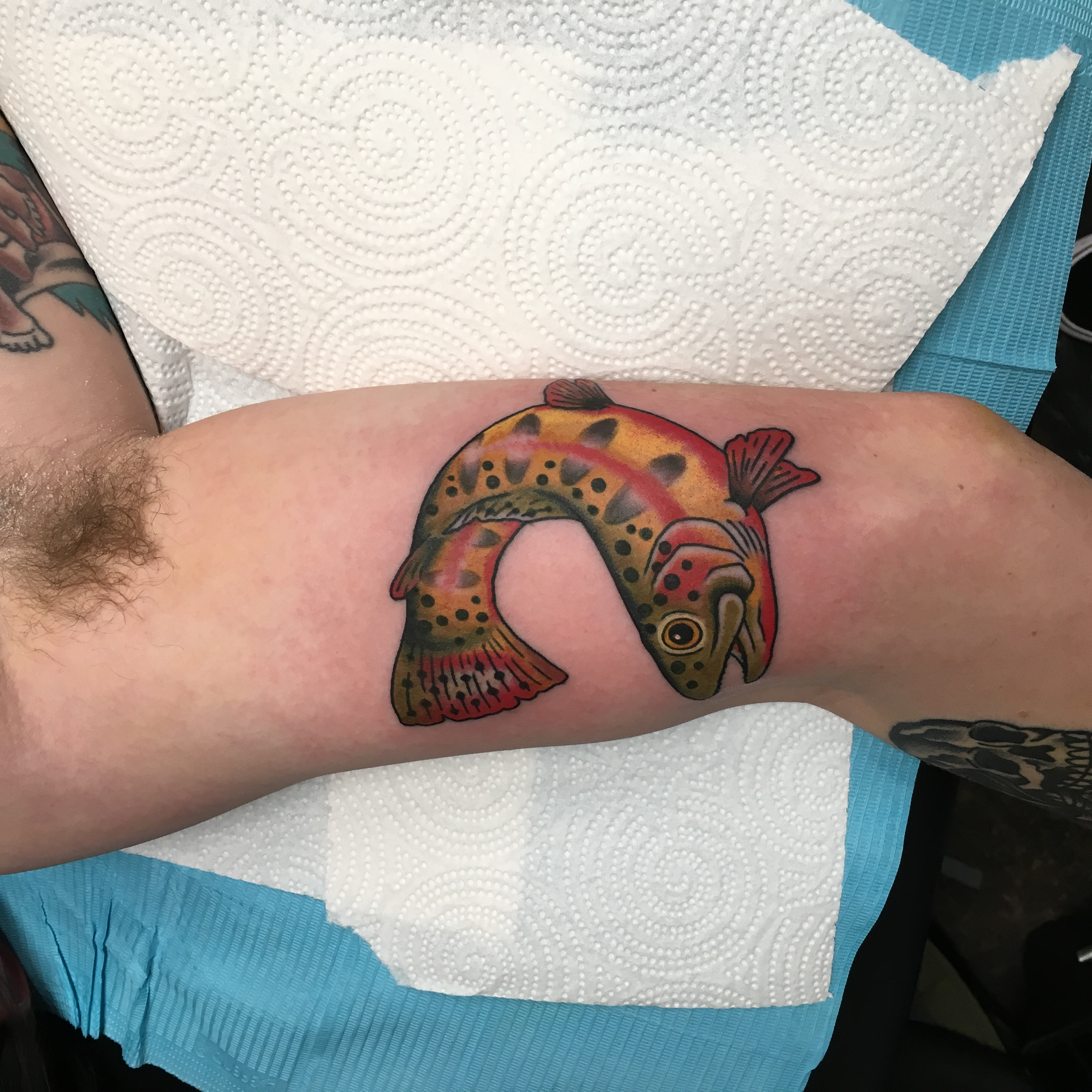 Fellow tattoo artists' views on Drew Wilson's unique fly fishing tattoo niche.