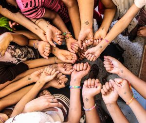 Coptic student wrist cross tattoo