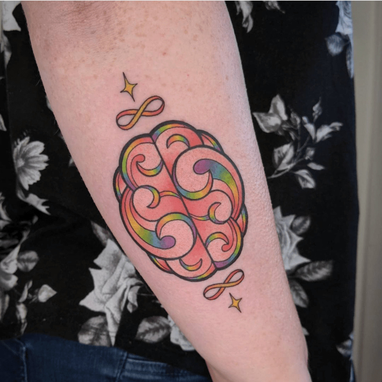 Abstract watercolor tattoo with flowing lines and colors, a unique artistic expression of autism