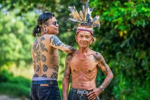 Boy Skrang, a renowned Iban tattoo artist, in his element at Entalau.