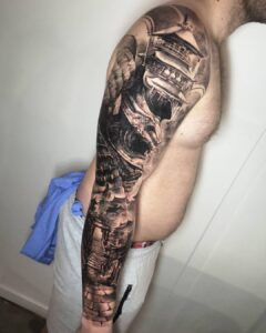 Mish working on a tattoo, reflecting the mental focus and dedication required