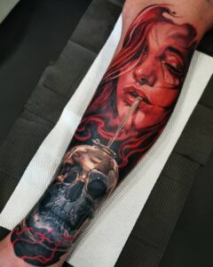 Mish's black and grey realism tattoo showcasing contrast and structure