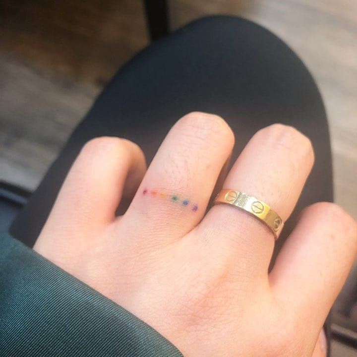 Rainbow dotted ring tattoo for a fun look