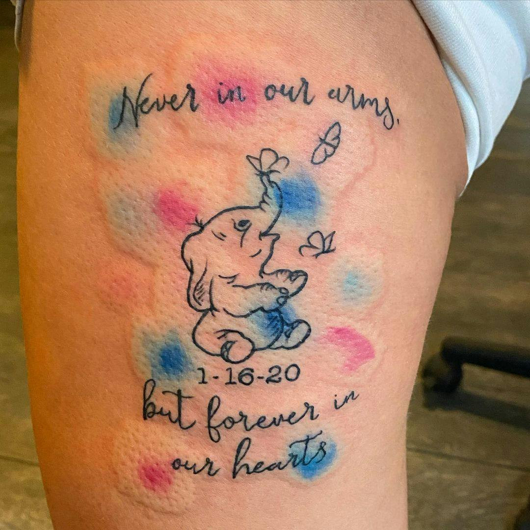 In our hearts quote and character miscarriage tattoo on arm.