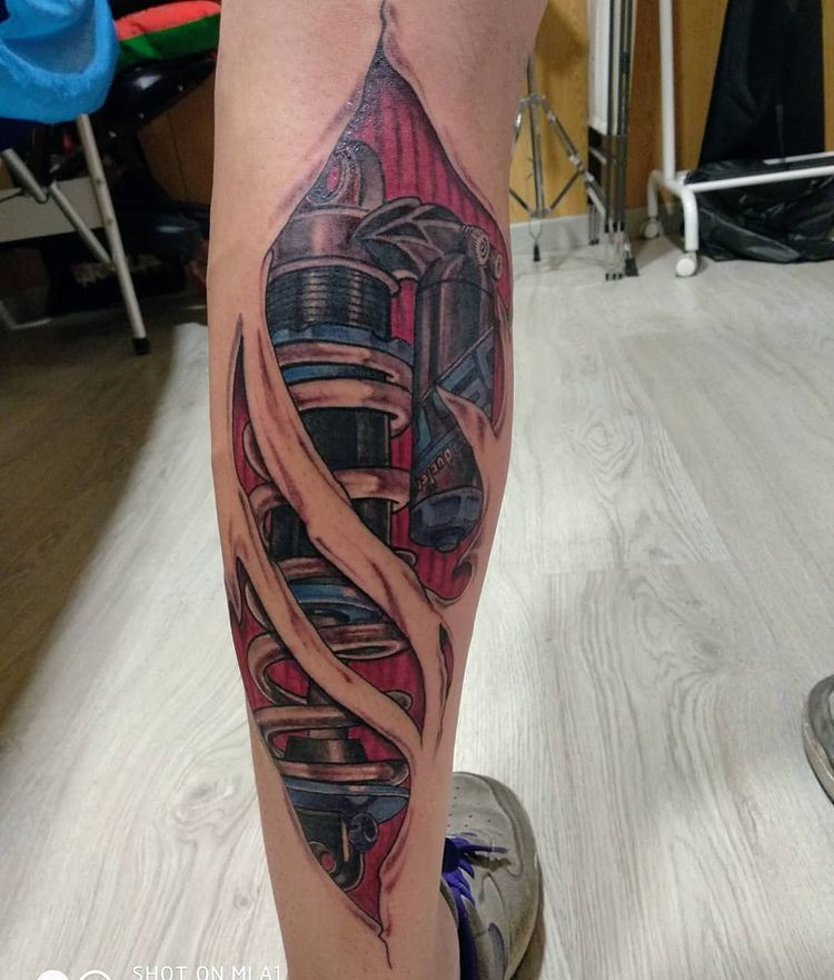 badass biomechanical tattoo with robotic arm