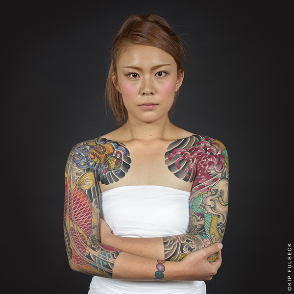 Exhibition view showcasing a full bodysuit Japanese tattoo photograph