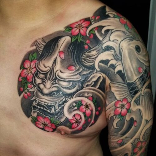 Japanese art tattoo featuring anime-inspired characters and vibrant colors