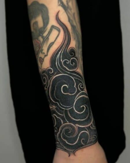 Japanese cloud tattoo in swirling grey and white as a background element