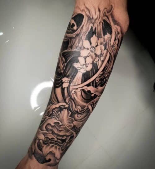 Japanese forearm tattoo with koi fish and water waves in blue and grey
