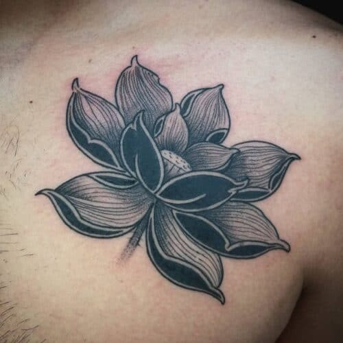 Japanese lotus tattoo in full bloom with detailed petals and leaves