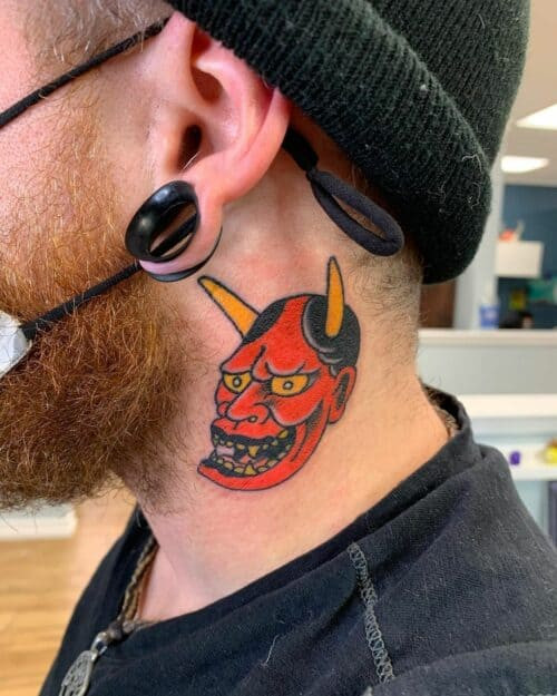 Japanese neck tattoo featuring a dragon head and flowing lines