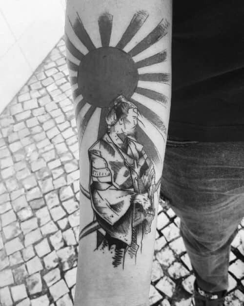 Japanese sun tattoo in solid red disc with radiating lines