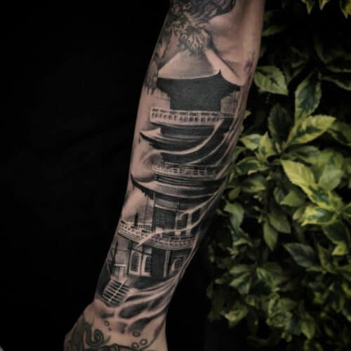 Japanese temple tattoo with intricate architecture and peaceful setting