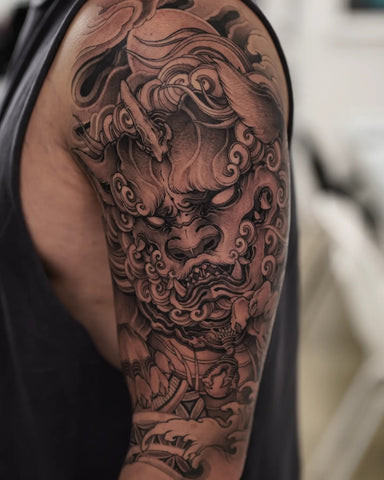 Intricate Foo Dog Tattoo on Back in Black and Gray Style