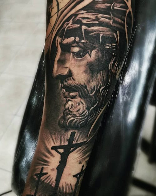 Jesus Christ portrait tattoo on forearm