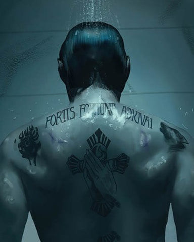 John Wick back tattoo, a large cross with the Latin phrase &quot;Fortis Fortuna Adiuvat&quot;