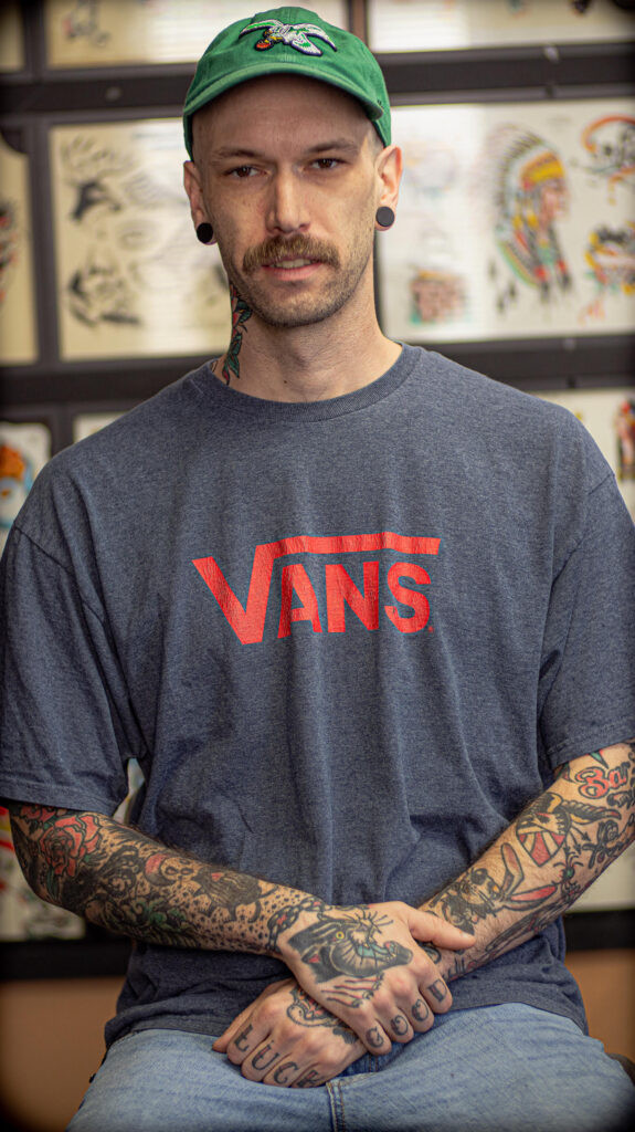 Justin Schmidt, tattoo artist specializing in painting and tattooing at Knoxville's Saint Tattoo studio.