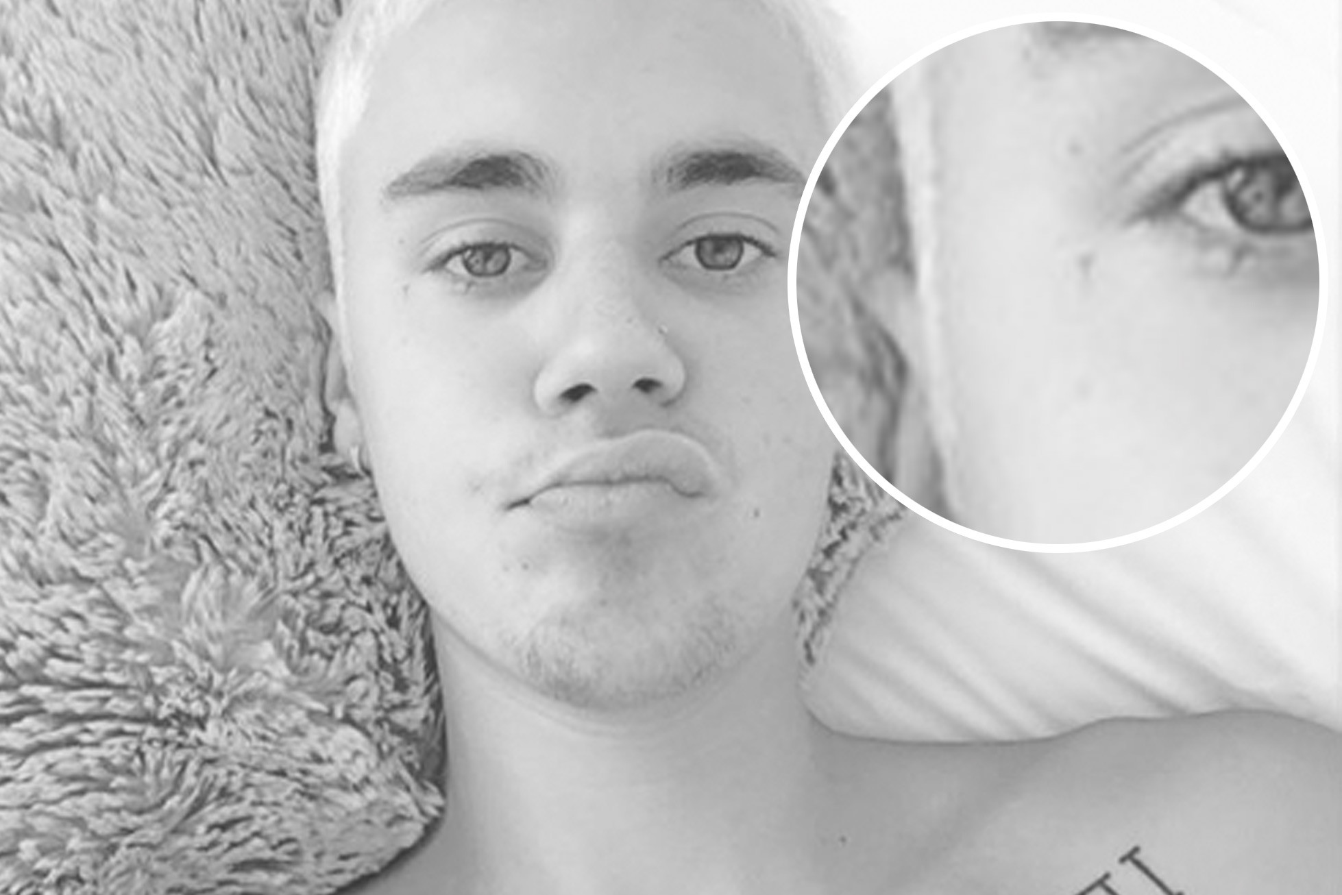 Close-up of Justin Bieber's face showing a very small cross tattoo near the corner of his right eye.