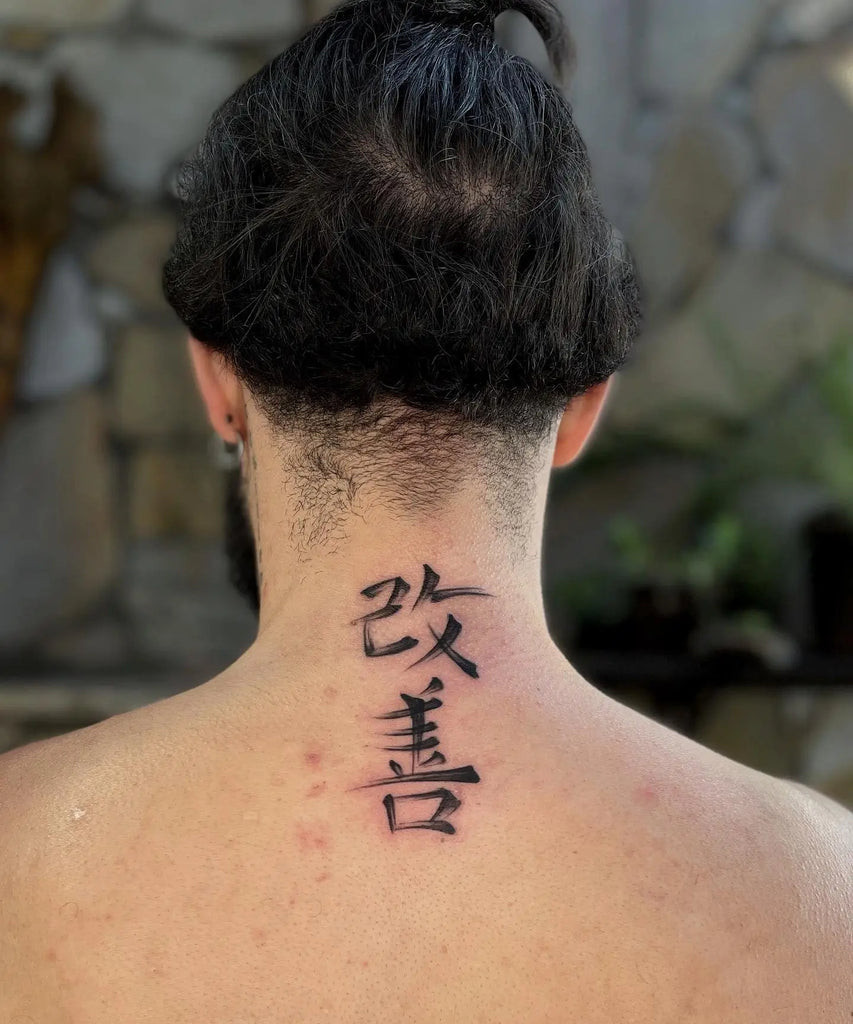 Artistic Kaizen tattoo with abstract color splashes and brush strokes, conveying dynamic and evolving self-expression