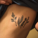 Parsley Sage Rosemary and Thyme herbs tattoo on rib cage for personal meaning and music tribute