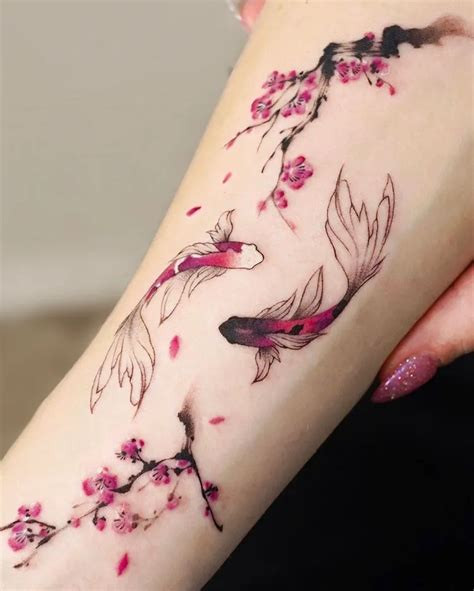 Koi fish tattoo with cherry blossom design