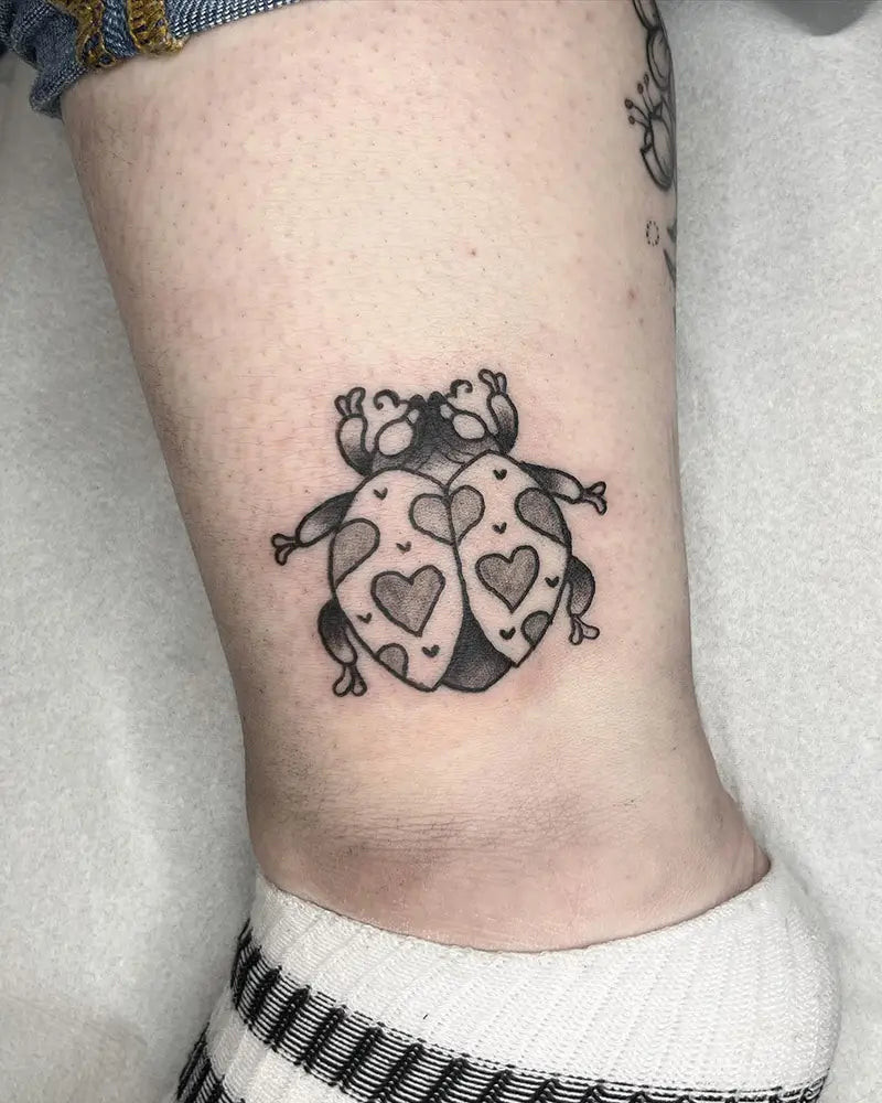 A cartoon style ladybug tattoo with a whimsical and playful expression, created by Eniko_tattoo