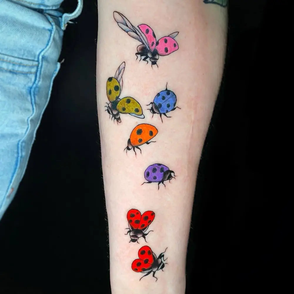 A ladybug tattoo in a unique style, demonstrating versatility in design, created by Boobyhill_