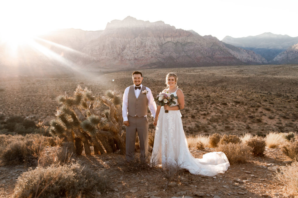 Eloped couple proudly displaying their mountain and evergreen tree tattoos.