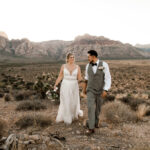 Couple shares a kiss against the backdrop of Red Rock Canyon for their elopement.