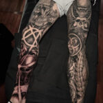 Man with full leg sleeve tattoo