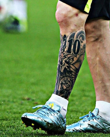 Soccer themed leg tattoo for men with a portrait of a famous player