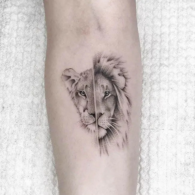 alt text: Majestic lion tattoo in black and grey ink on shoulder, symbolizing courage, leadership, and strength as king of the jungle