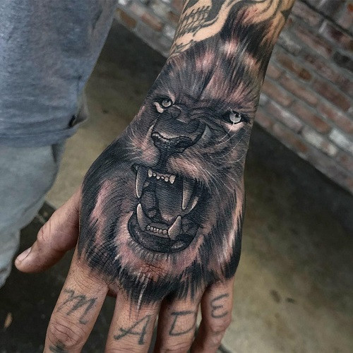 Lion Tattoo on Hand, lion tattoo on the back of the hand, bold and visible