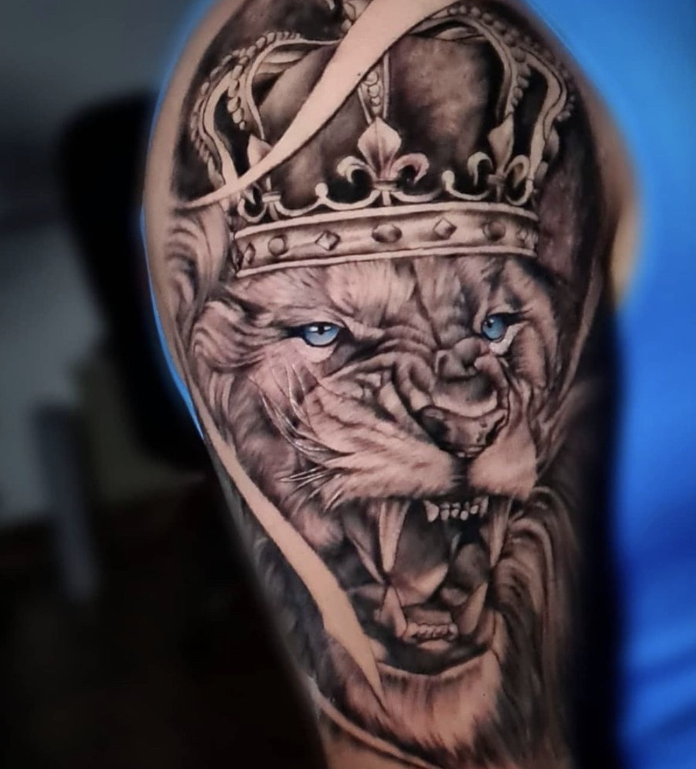 Lion with Crown Tattoo for men, black and grey ink, detailed crown