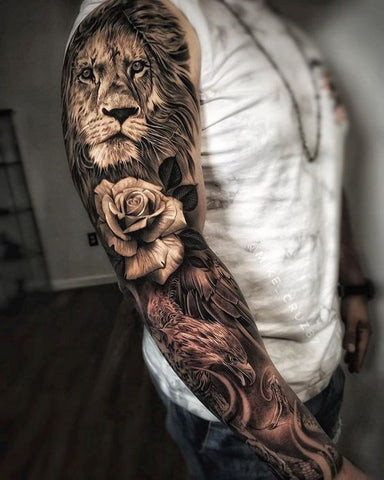 Lion sleeve tattoo featuring a roaring lion with floral and geometric elements