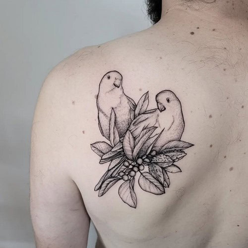 Romantic love bird tattoo for men, symbolizing love, fidelity, and commitment in relationships