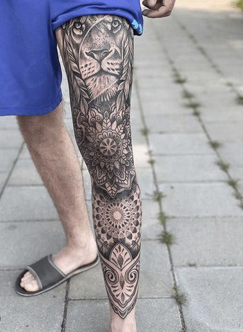 Mandala leg tattoo for men symbolizing balance and harmony