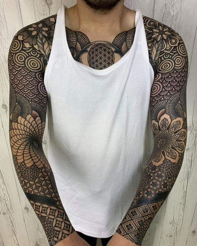 Mandala sleeve tattoo featuring intricate mandala patterns and geometric shapes in black ink