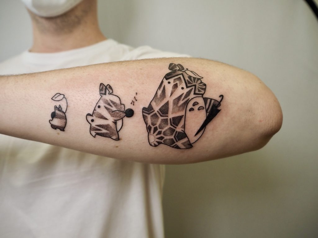 Mimi-Sama's Totoro manga tattoo, showcasing blackwork style